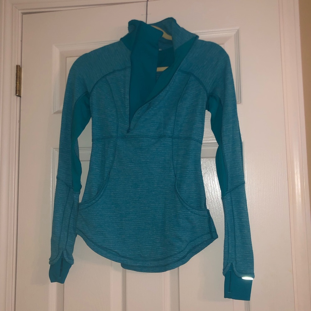 Turquoise Lululemon half zip pullover jacket.